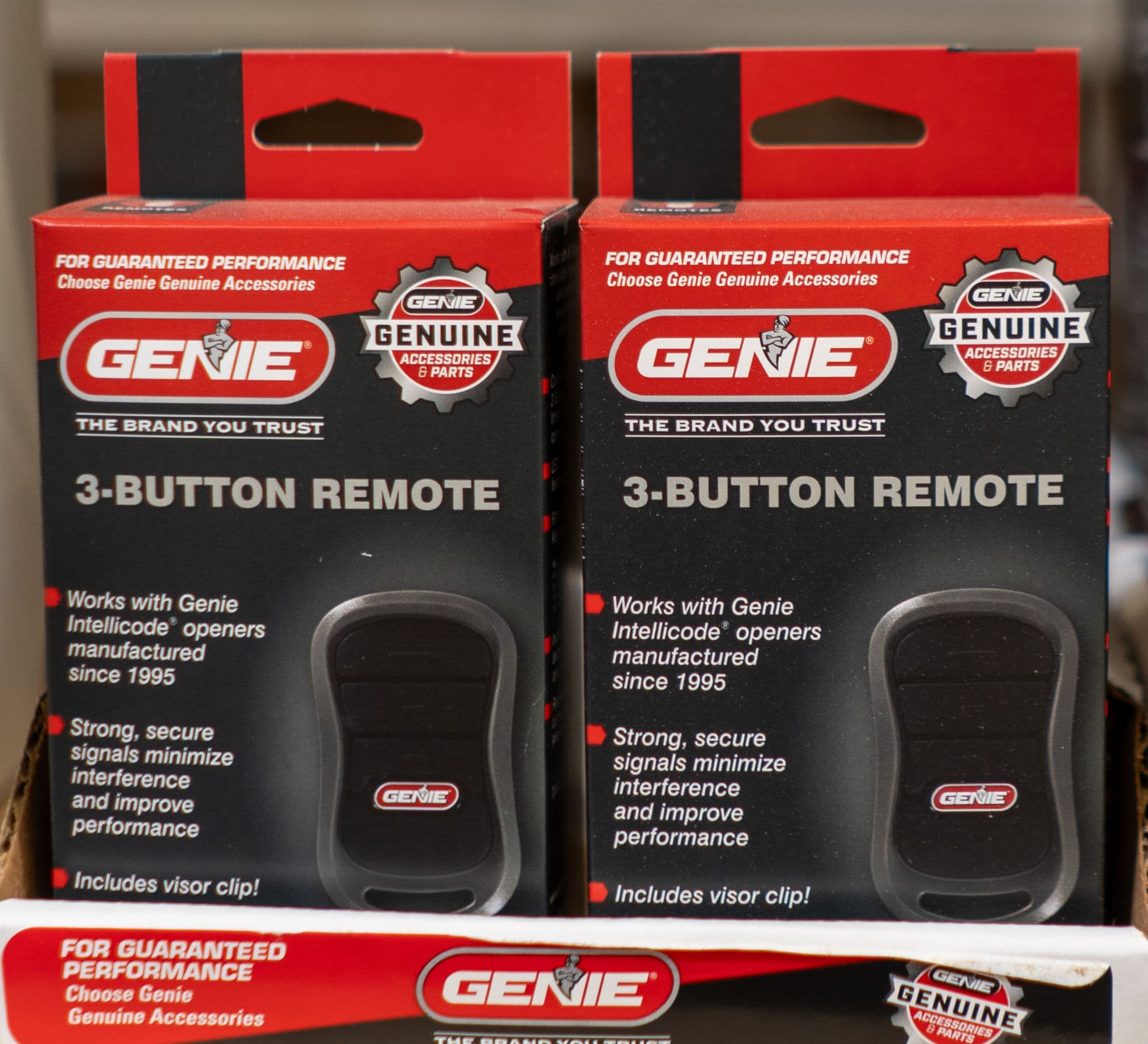 Genie 3-button remote control packaging with features and compatibility details.